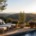 Peaceful hillside terrace with lounge chairs and pool at a private residence offering fentanyl rehab in Los Angeles
