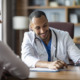 A doctor smiling while talking with a patient for the topic best alcohol addiction treatment centers.