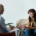 A woman smiling while talking to a therapist for the topic best dual diagnosis treatment centers.